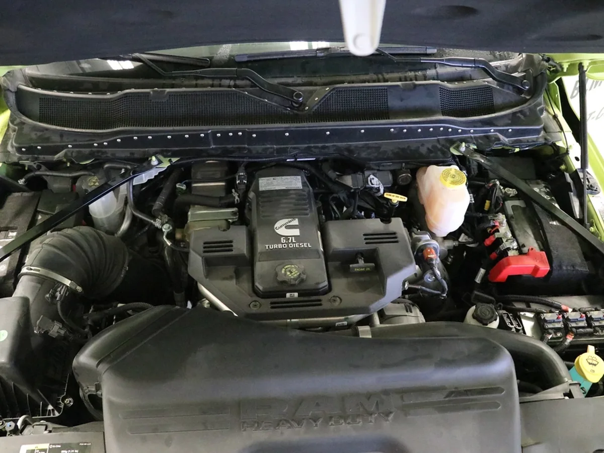 The engine bay of a pickup truck with its bonnet open.