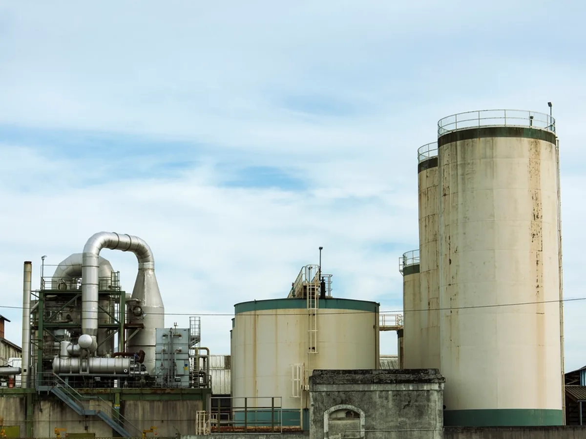 Storage tanks, silos and process pipework at a chemical plant.