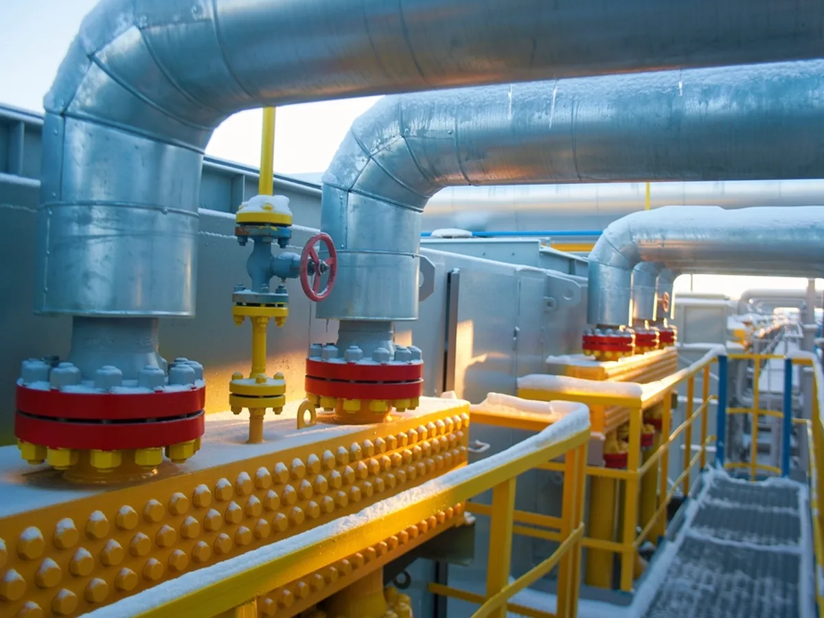 Insulated gas pipelines and valves at a gas processing facility.